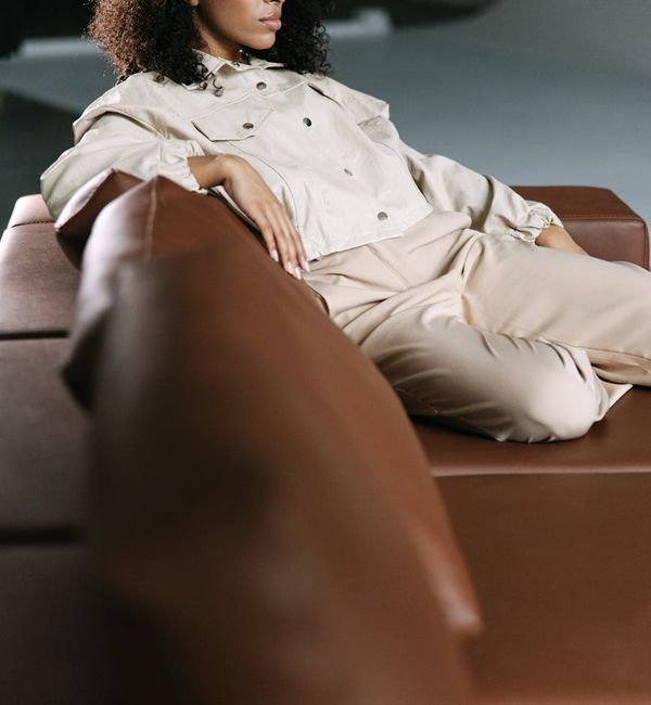Person sitting peacefully with a serene natural background.
